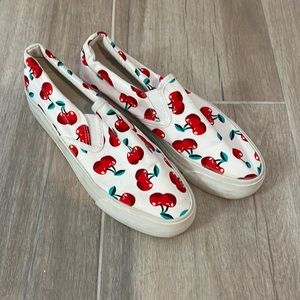 White slip on sneakers with red cherries. Only worn a handful of times.